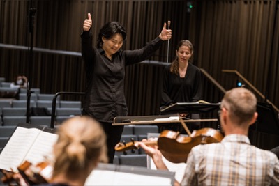 Rira Kim giving thumbs up during rehearsal